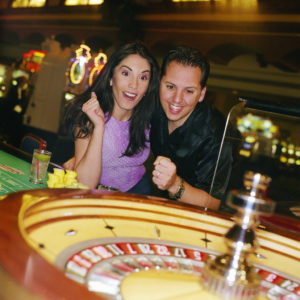 Man and Woman Playing Roulette